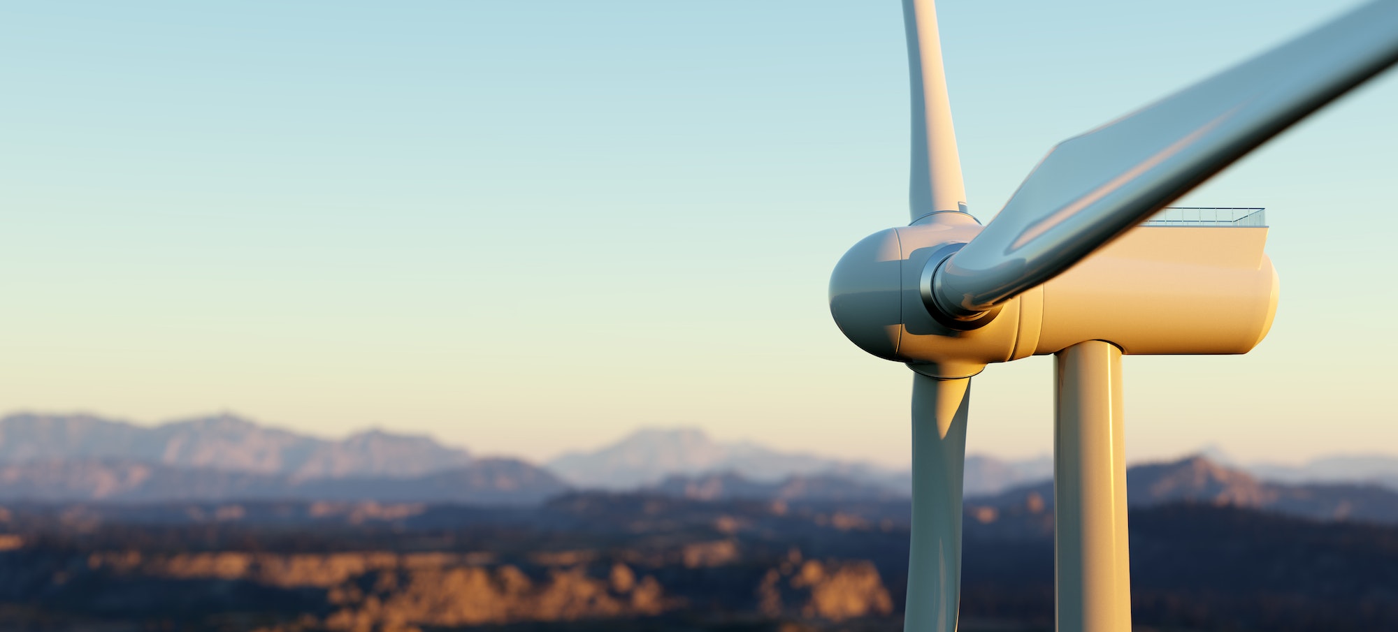 Wind turbine close up against a backdrop of rolling hills